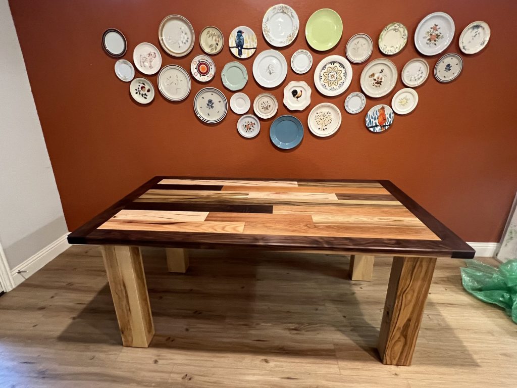 Mixed hardwood dining table with walnut border