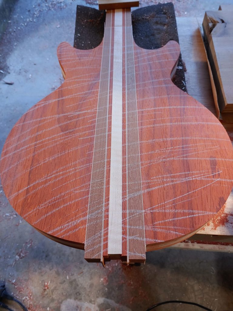 Padauk guitar body blank with maple center stripe