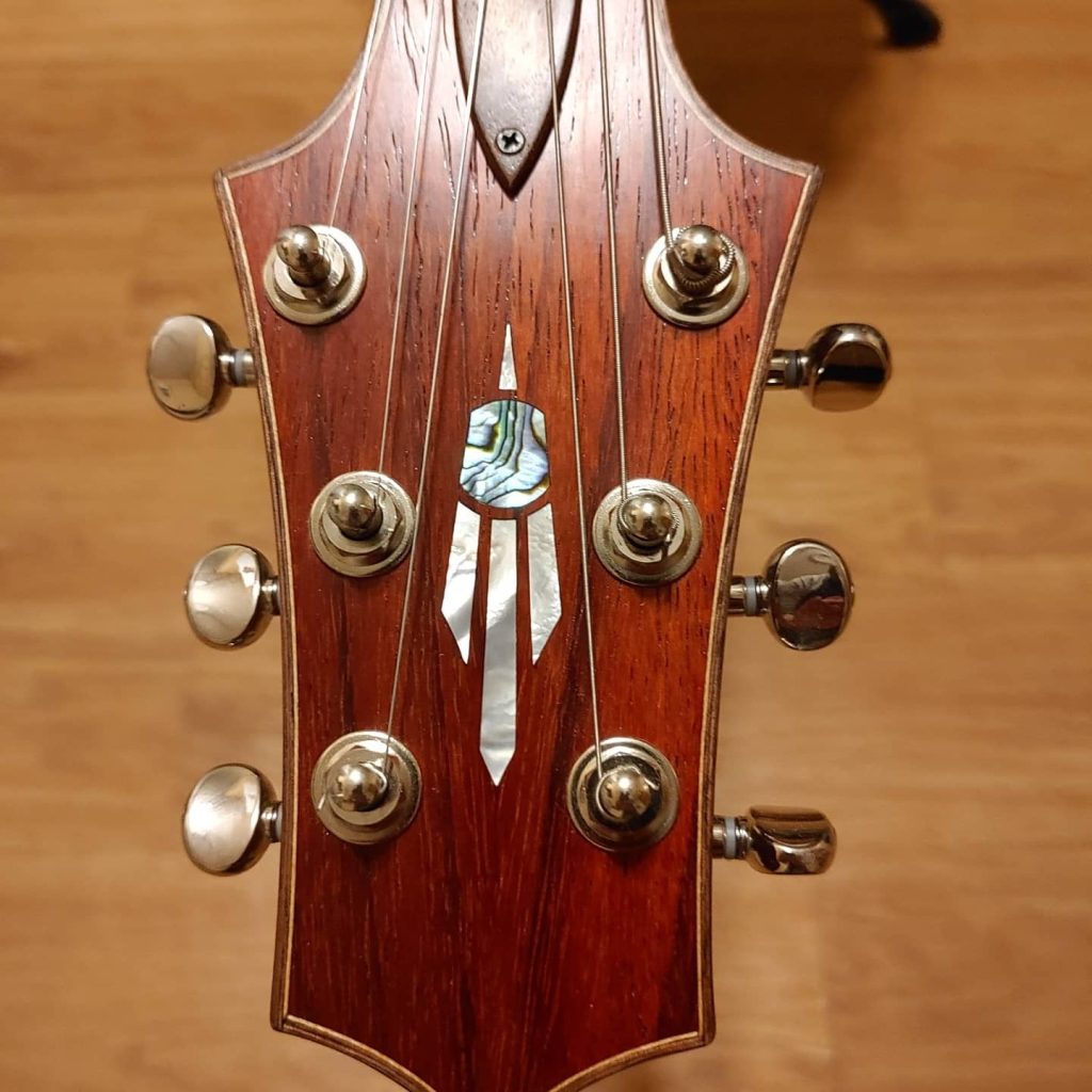 Padauk guitar headstock with abalone feather inlay