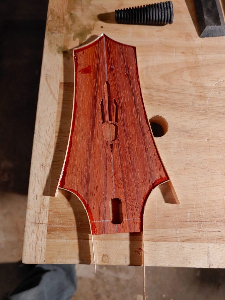 Padauk headstock with inlay routed