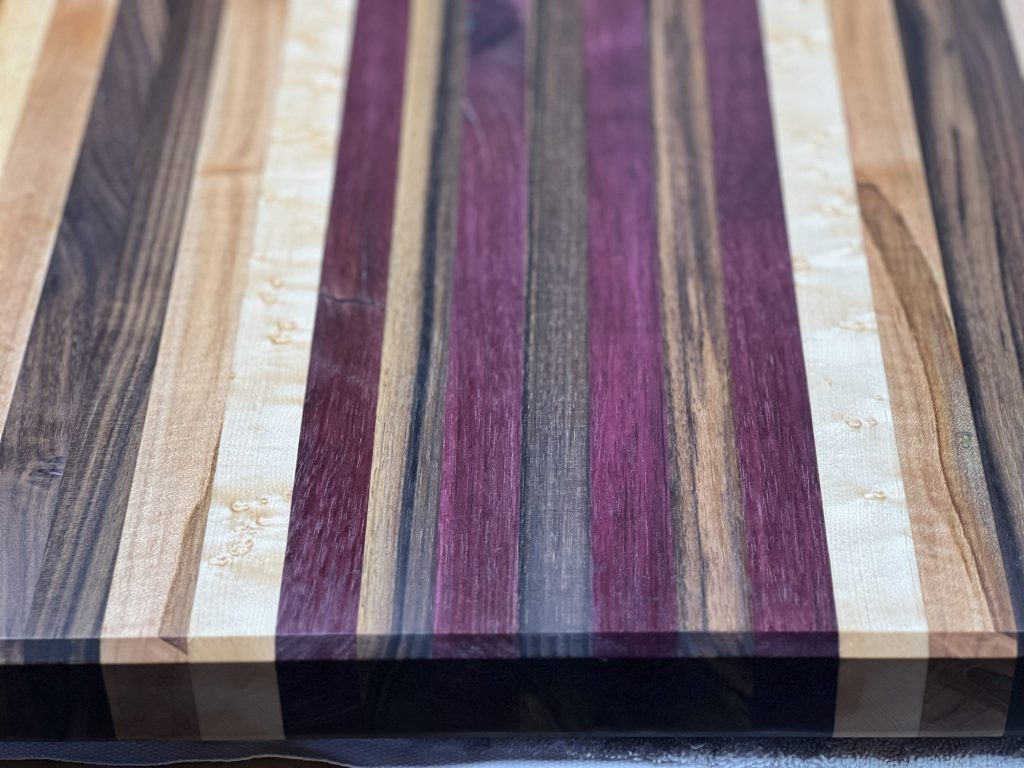 Close-up of a purpleheart striped cutting board